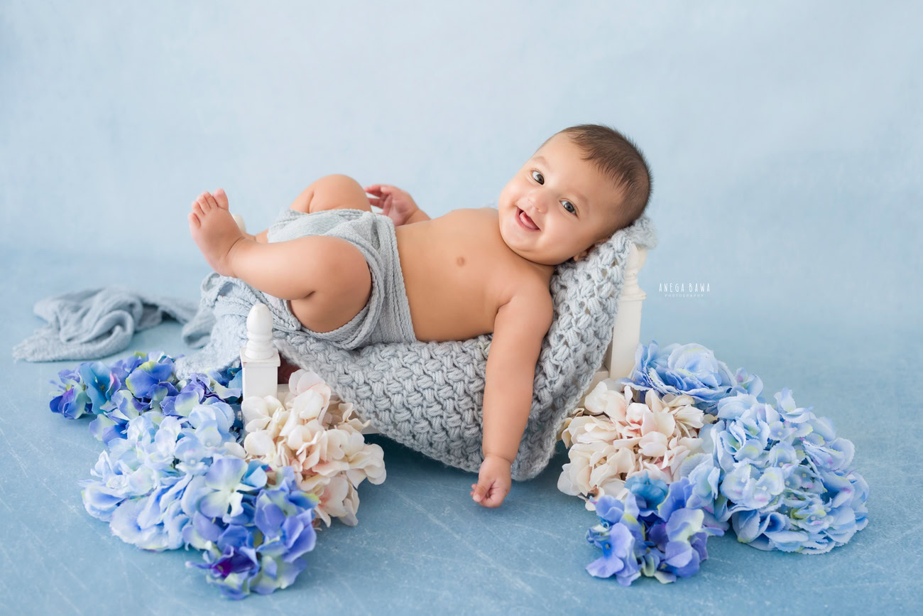 Baby boy photoshoot, 6 or 5 or 4 or 3 months, grey backdrop, grey wrap. Location: Delhi, Gurgaon, Noida. Photographer: Anega Bawa.