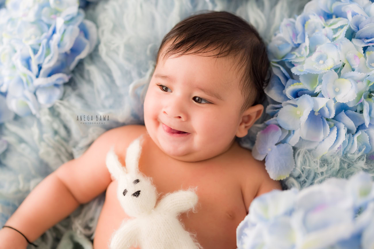 Baby boy photoshoot, 6 or 5 or 4 or 3 months, grey backdrop, white soft toy, Delhi Gurgaon Noida, Anega Bawa.