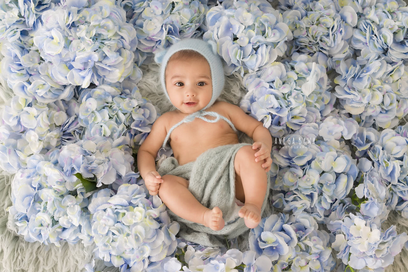 Baby boy photoshoot, 6 or 5 or 4 or 3 months, grey wrap, blue cap, blue flower backdrop, Delhi Gurgaon Noida, Anega Bawa.