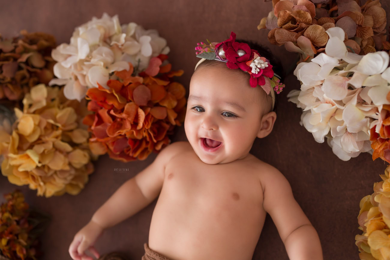 Baby girl photoshoot, 3, 4, 5, or 6 months, cute headband, multicolor flowers. Location: Delhi, Gurgaon, Noida. Photographer: Anega Bawa.