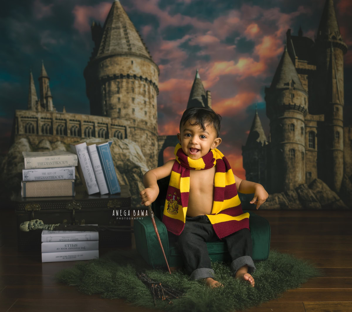 In this delightful toddler photoshoot captured by Anega Bawa in Delhi, Gurgaon, and Noida, a 15-month-old boy sits on a green sofa, holding a stick in his hand. Behind him, a bookshelf adds a touch of character to the scene. With his innocent expression and playful demeanor, the boy brings warmth and joy to the frame, creating a cherished memory for years to come.