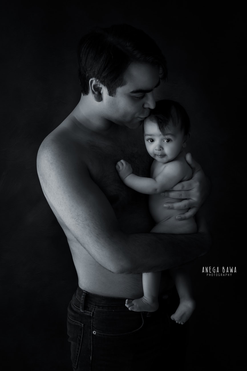Capture the sweet bond between Dad and daughter in timeless black and white. With Anega Bawa Photography in Delhi and Gurgaon, cherish the precious moments of love and affection as they share a heartwarming hug against a classic backdrop.