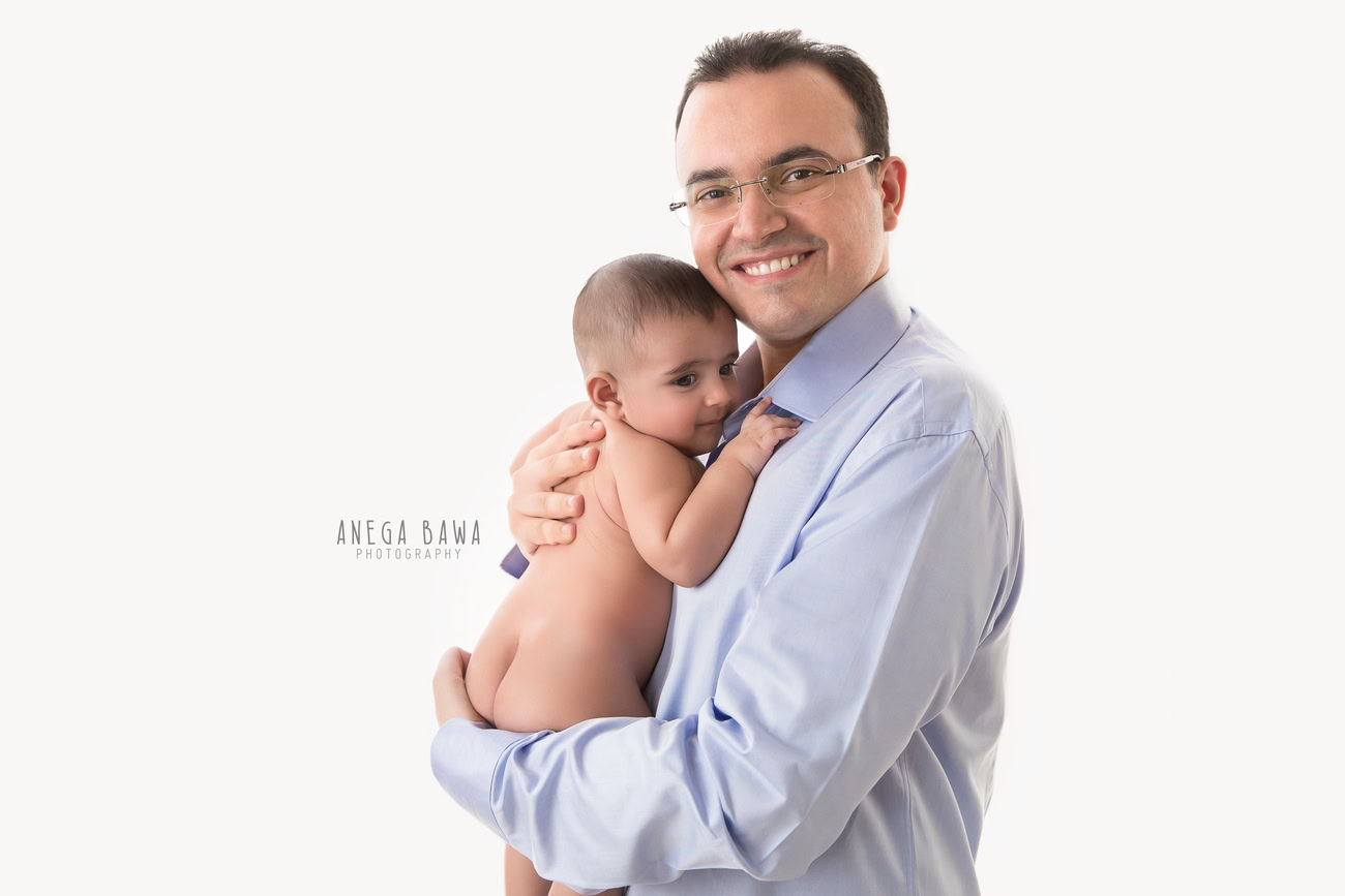 In the heart of Delhi and Gurgaon, Anega Bawa Photography freezes a heartwarming moment between father and son, as they share an endearing hug against a pristine white backdrop. It's a snapshot of love and affection, captured beautifully by Anega Bawa's lens.