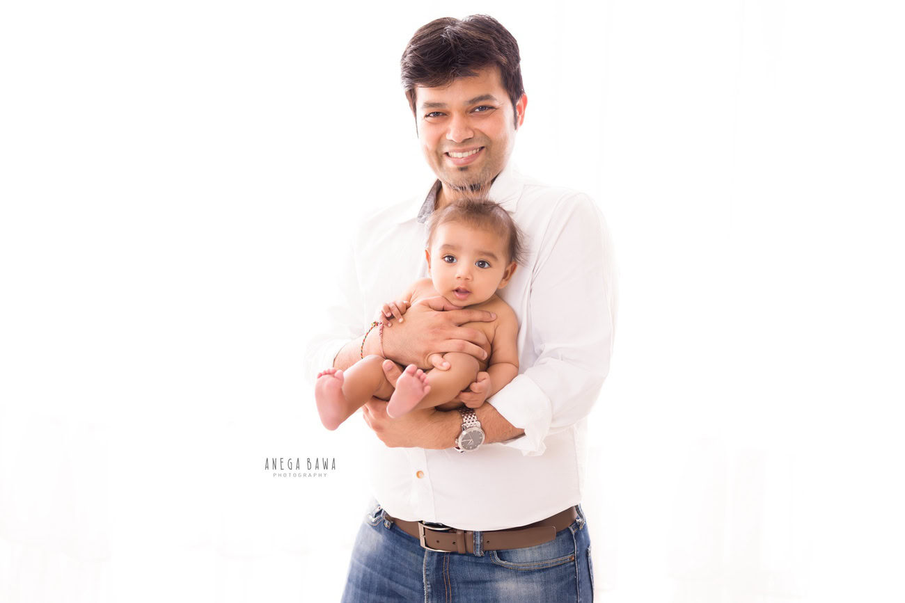 Capture the precious moments of father-son bonding with Anega Bawa Photography in Delhi and Gurgaon. Against a pristine white backdrop, the love and connection between them shine through, immortalizing their journey together in beautiful imagery.