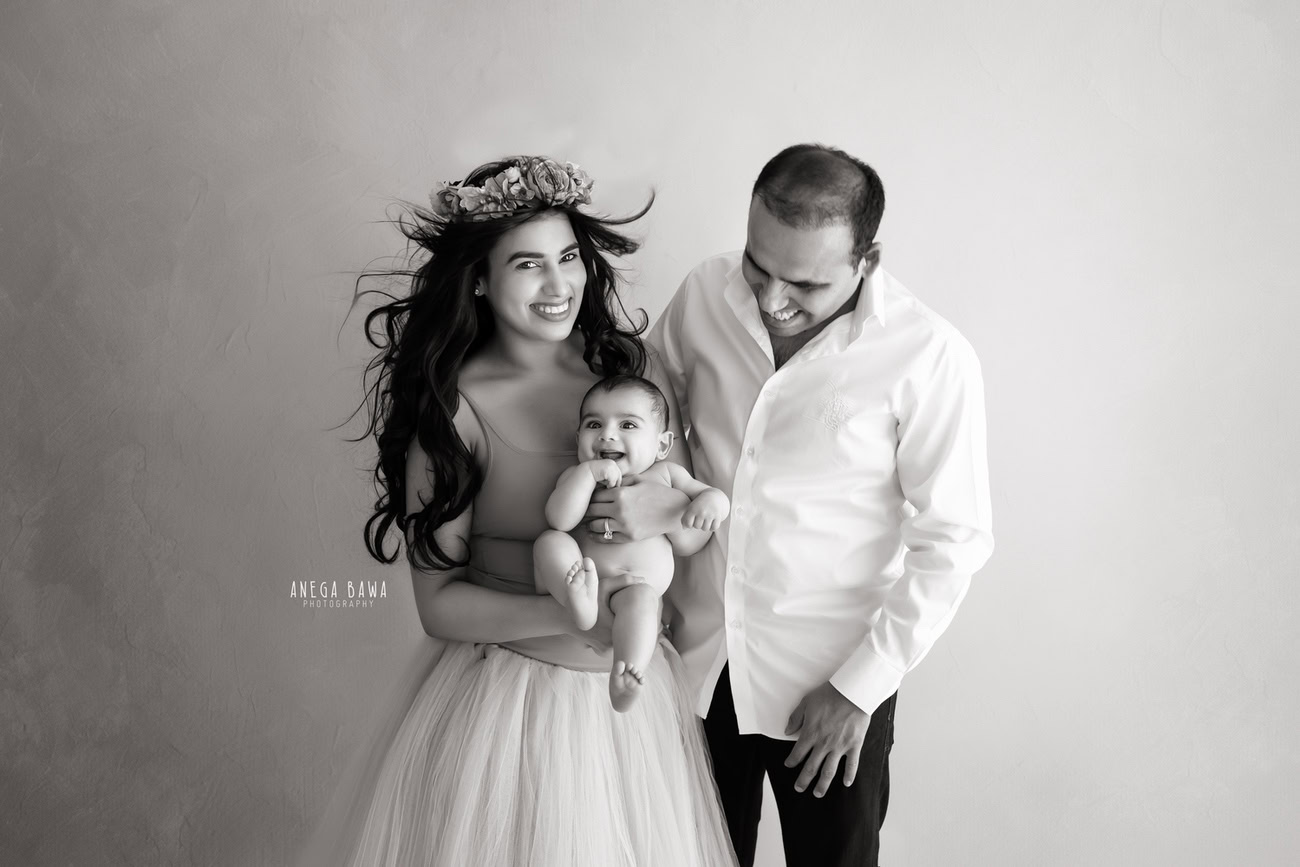 Create lasting memories with a family photoshoot capturing Mumma, Papa, and their little boy in the tender embrace of love and togetherness. Against a classic black-and-white backdrop, Anega Bawa Photography in Delhi and Gurgaon will immortalize these precious moments, reflecting the timeless beauty of family bonds.