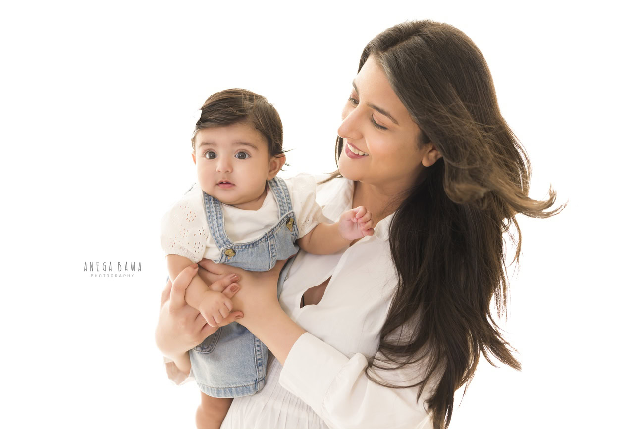 A family photoshoot where the mom is posing with her daughter against a white backdrop can be a heartwarming and beautiful experience. Anega Bawa Photography in Delhi and Gurgaon specializes in capturing these precious moments with skill and creativity, ensuring that the bond between mother and daughter is beautifully portrayed in each photograph.