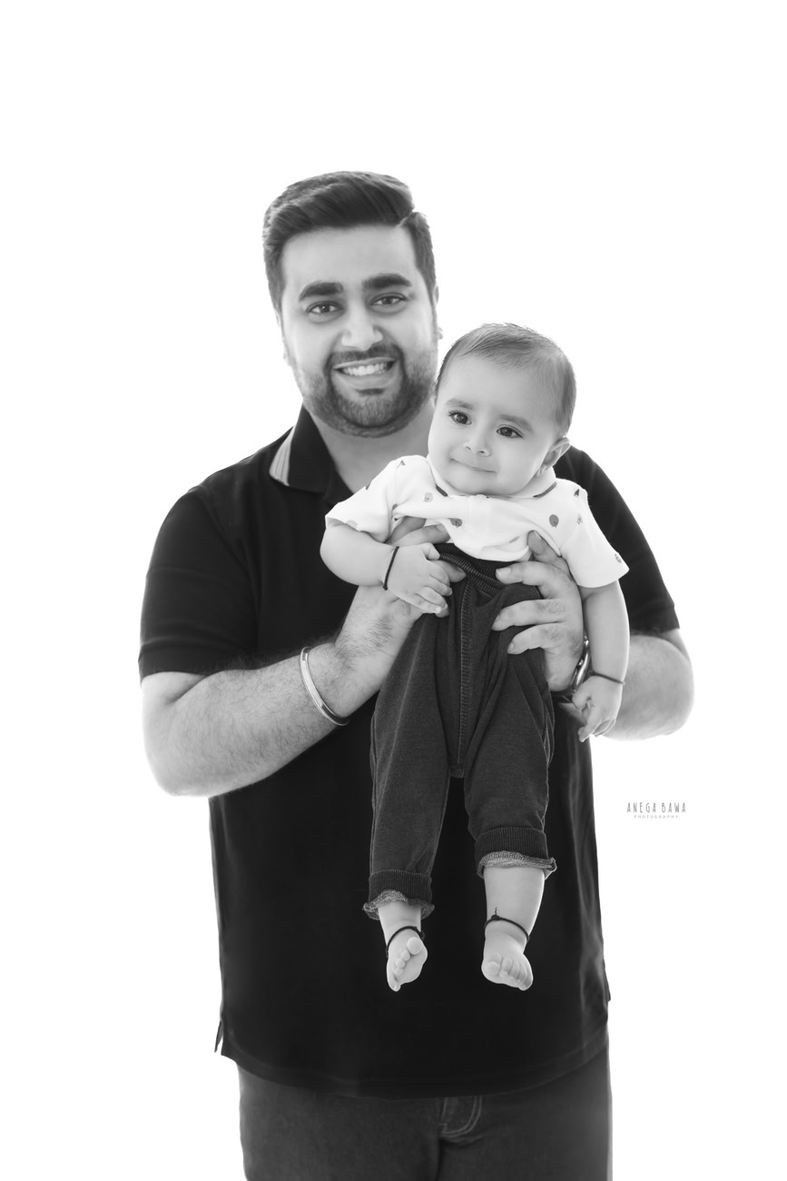 Preserve the special bond between father and son with a heartwarming family photoshoot against a pristine white backdrop by Anega Bawa Photography in Delhi and Gurgaon. Cherish these timeless memories for years to come.