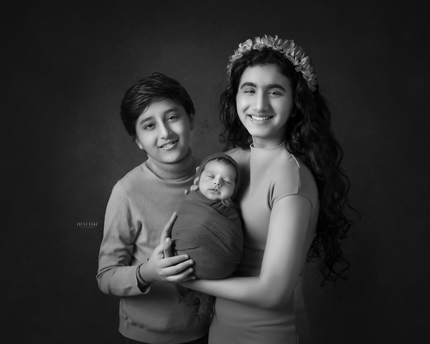 Beautiful family portrait of siblings with newborn, black and white photography, capturing love and connection, professional family photo shoot, Anega Bawa Photography.