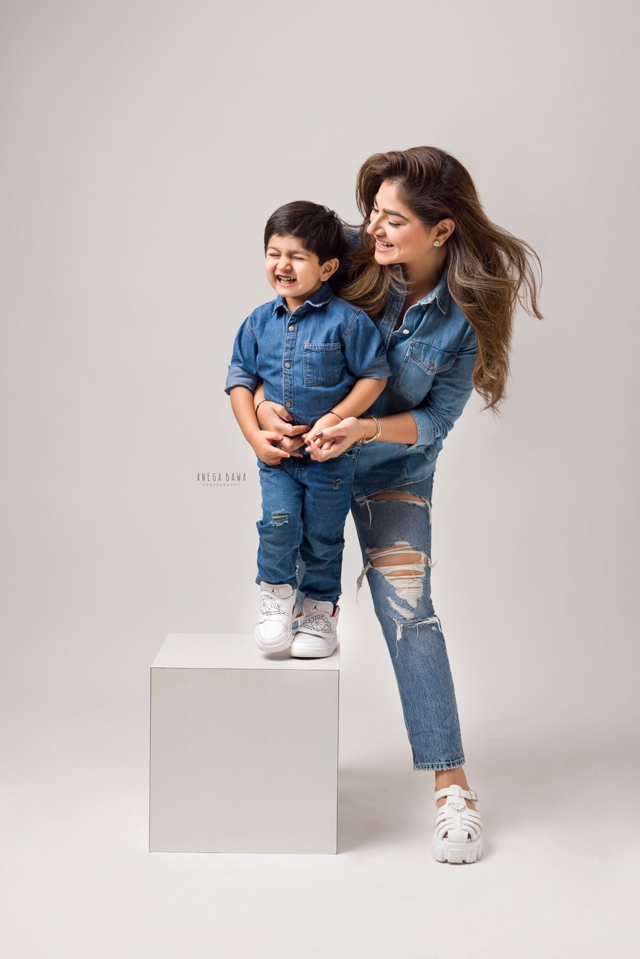 Cute mother and son portrait in denim, joyful childhood moments captured by Anega Bawa Photography.