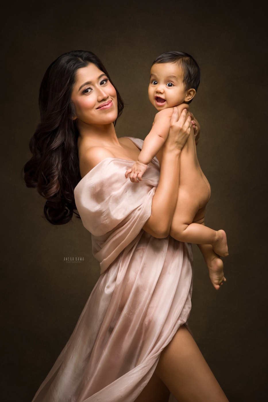 Elegant mother and adorable baby photography portrait.