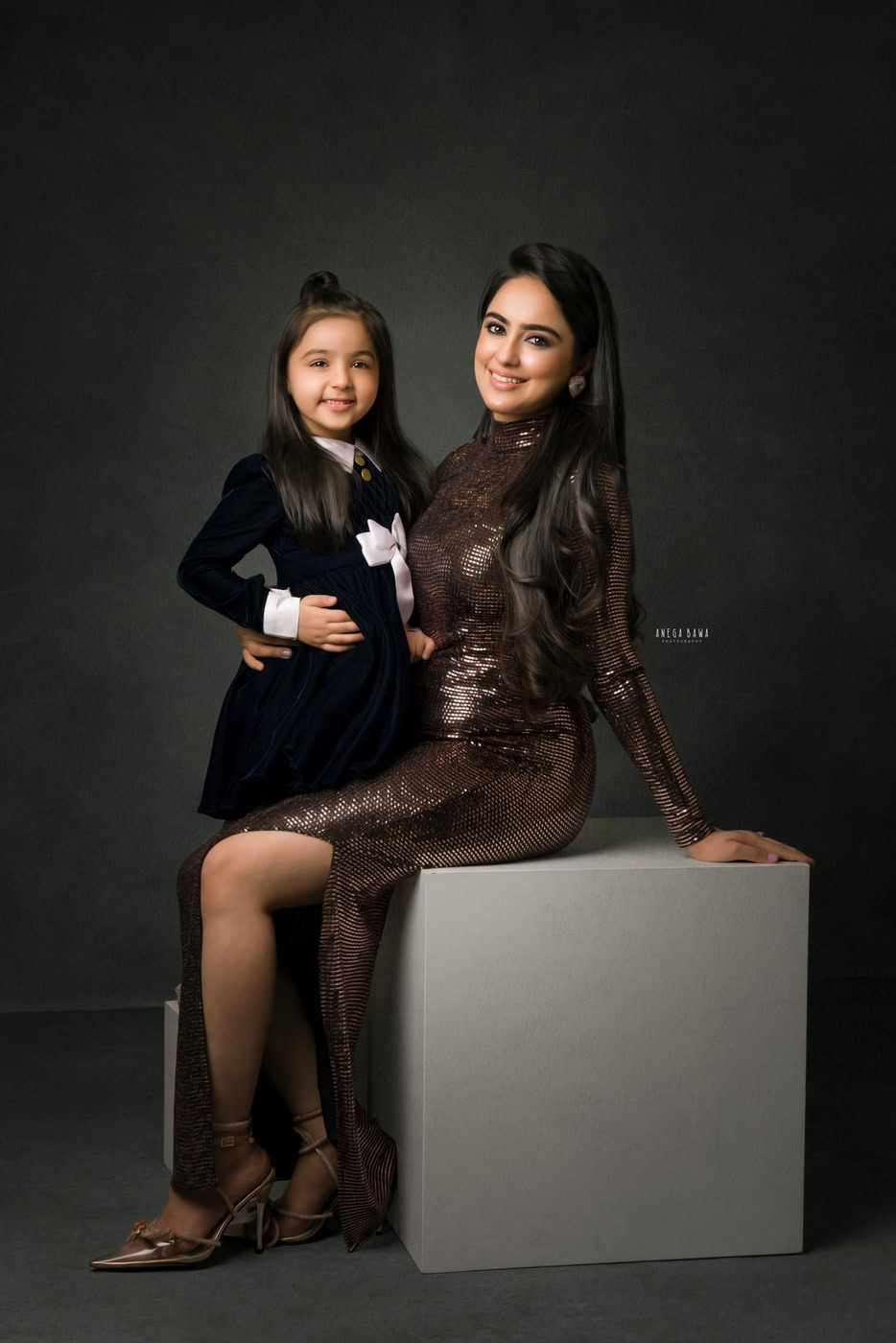 Elegant woman and young girl portrait in stylish outfits, professional photography by Anega Bawa.