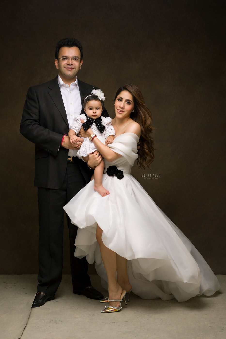 Elegant family portrait with stylish attire, showcasing professional photography by Anega Bawa for wedding and family portrait sessions.